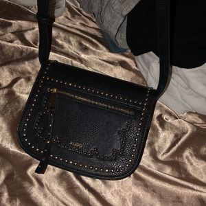 I am selling a black crossover body Aldo bag.